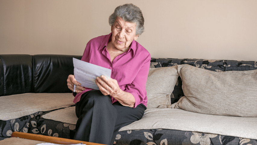 Senior Women Holding Letter