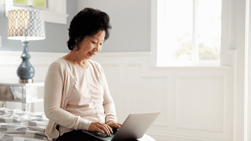 Senior woman using laptop computer.