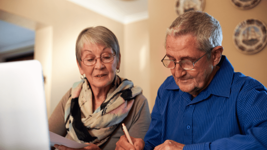 Elder couple checking their finances.